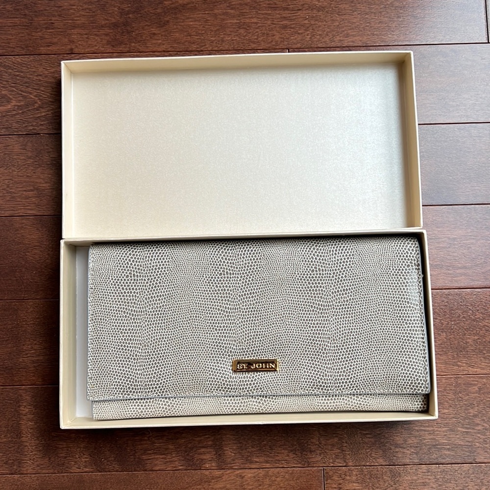 St. John embossed leather travel wallet. Unused; perfect condition.